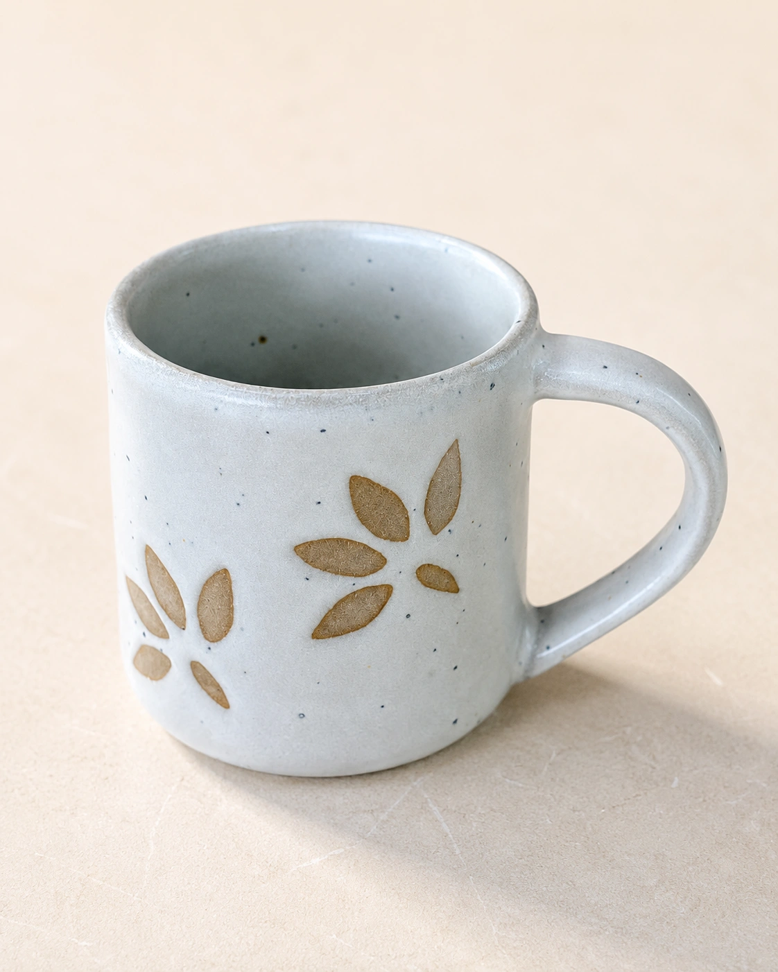 Ivory Petal Relief Ceramic Mug by Hira Industries